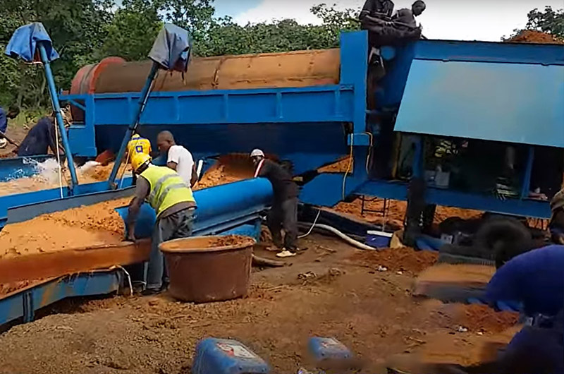 Gold ore is cleaned of clay in a rotating screen